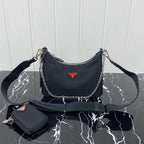 PRADA HOBO 22 BAG IN BLACK RE-NYLON WITH RED LOGO