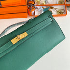 HERMES KELLY CUT 31 IN GREEN FOREST CALFSKIN WITH GOLD HARDWARE