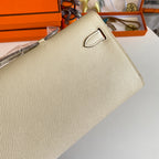 HERMES KELLY CUT 31 IN BEIGE CREAM CALFSKIN WITH GOLD HARDWARE
