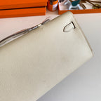HERMES KELLY CUT 31 IN BEIGE CREAM CALFSKIN WITH SILVER HARDWARE