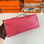 HERMES KELLY CUT 31 IN WATERMELON PINK CALFSKIN WITH SILVER HARDWARE