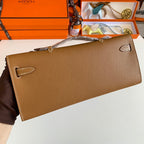 HERMES KELLY CUT 31 IN BRONZE BROWN CALFSKIN WITH SILVER HARDWARE