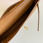 HERMES KELLY CUT 31 IN BRONZE BROWN CALFSKIN WITH GOLD HARDWARE