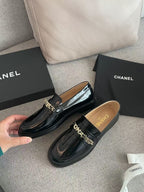 CHANEL MOASINS IN BLACK CALFSKIN GOLD METAL LOGO