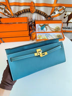 HERMES KELLY CUT 31 IN AZURE BLUE CALFSKIN WITH GOLD HARDWARE