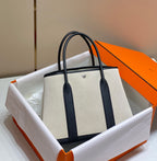 HERMES GARDEN PARTY 36CM IN WHITE TOILETS COTTON CANVAS AND BLACK CALFSKIN