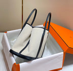 HERMES GARDEN PARTY 36CM IN WHITE TOILETS COTTON CANVAS AND BLACK CALFSKIN