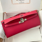 HERMES KELLY CUT 31 IN CHERRY RED CALFSKIN WITH SILVER HARDWARE