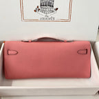 HERMES KELLY CUT 31 IN SALMON PINK CALFSKIN WITH SILVER HARDWARE
