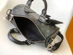 LOUIS VUITTON KEEPALL BANDOULIÈRE 25 IN BLACK MONOGRAM HERITAGE CANVAS