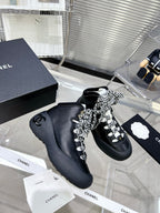 CHANEL CANO ALTO SNEAKER IN BLACK CALFSKIN AND RUBBER