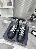 CHANEL CANO ALTO SNEAKER IN BLACK CALFSKIN AND RUBBER