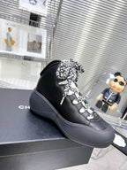 CHANEL CANO ALTO SNEAKER IN BLACK CALFSKIN AND RUBBER