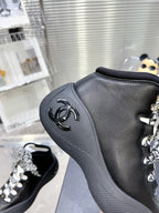 CHANEL CANO ALTO SNEAKER IN BLACK CALFSKIN AND RUBBER