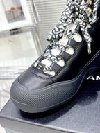 CHANEL CANO ALTO SNEAKER IN BLACK CALFSKIN AND RUBBER