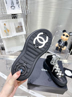 CHANEL CANO ALTO SNEAKER IN BLACK CALFSKIN AND RUBBER
