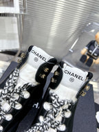 CHANEL CANO ALTO SNEAKER IN BLACK CALFSKIN AND RUBBER