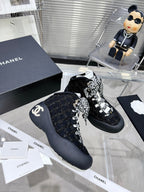 CHANEL CANO ALTO SNEAKER IN BLACK TWEED AND RUBBER