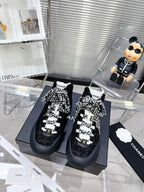 CHANEL CANO ALTO SNEAKER IN BLACK TWEED AND RUBBER