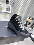 CHANEL CANO ALTO SNEAKER IN BLACK TWEED AND RUBBER
