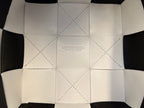 BOTTEGA VENETA SMALL CASSETTE BUCKET 18 IN WHITE MIX BLACK CALFSKIN