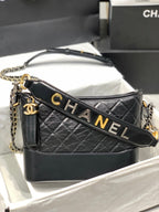 CHANEL HOBO BAG 25 WITH STRAP IN BLACK CALFSKIN GOLD AND SILVER HARDWARE