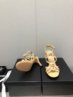 CHANEL FLORAL HIGH HEEL SANDAL IN SAND YELLOW LAMBSKIN