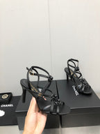 CHANEL FLORAL HIGH HEEL SANDAL IN BLACK LAMBSKIN