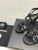 CHANEL FLORAL HIGH HEEL SANDAL IN BLACK LAMBSKIN