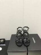 CHANEL FLORAL HIGH HEEL SANDAL IN BLACK LAMBSKIN