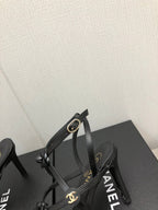 CHANEL FLORAL HIGH HEEL SANDAL IN BLACK LAMBSKIN