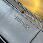 BOTTEGA VENETA SMALL CYLINDER CASSETTE 21 IN LAVA GRAY CALFSKIN