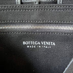BOTTEGA VENETA SMALL CASSETTE 23 IN BLACK CANVAS AND CALFSKIN TRIM
