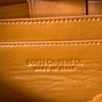 BOTTEGA VENETA SMALL BRICK CASSETTE 23 IN SANDSTONE ORANGE SOFT LAMBSKIN
