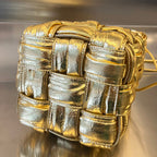 BOTTEGA VENETA SMALL CASSETTE BUCKET 18 IN GOLD METALLIC SOFT LAMBSKIN
