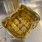 BOTTEGA VENETA SMALL CASSETTE BUCKET 18 IN GOLD METALLIC SOFT LAMBSKIN