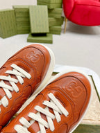 GUCCI EMBOSSED TRAINER CARAMEL CALFSKIN