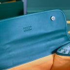 SAINT LÉGER BACKPACK 35 IN GREEN GOYARDINE CANVAS AND CALFSKIN WITH CARTOON PATCH
