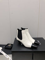 CHANEL SHORT BOOTS IN WHITE MIX BLACK SHEEPSKIN