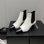 CHANEL SHORT BOOTS IN WHITE MIX BLACK SHEEPSKIN