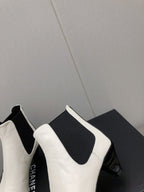 CHANEL SHORT BOOTS IN WHITE MIX BLACK SHEEPSKIN
