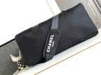 CHANEL TRAVEL BAG 45 IN BLACK CANVAS WITH WHITE LOGO