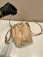 PRADA BUCKET BAG 19 IN BEIGE RE-NYLON AND SAFFIANO LEATHER HANDLE