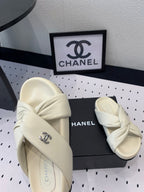 CHANEL TWISTED SLIPPERS IN WHITE LAMBSKIN