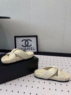 CHANEL TWISTED SLIPPERS IN WHITE LAMBSKIN