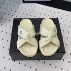 CHANEL TWISTED SLIPPERS IN WHITE LAMBSKIN