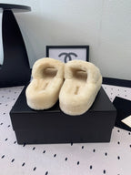 CHANEL THICK-SOLED SLIPPERS IN WHITE SHEEP WOOL