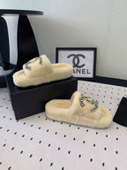 CHANEL THICK-SOLED SLIPPERS IN WHITE SHEEP WOOL