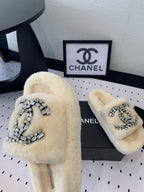 CHANEL THICK-SOLED SLIPPERS IN WHITE SHEEP WOOL