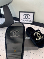 CHANEL THICK-SOLED SLIPPERS IN BLACK SHEEP WOOL
